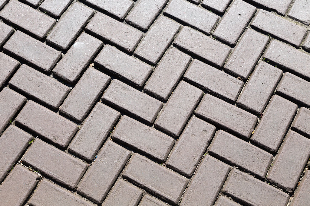 Dark gray brick pavers. Background.