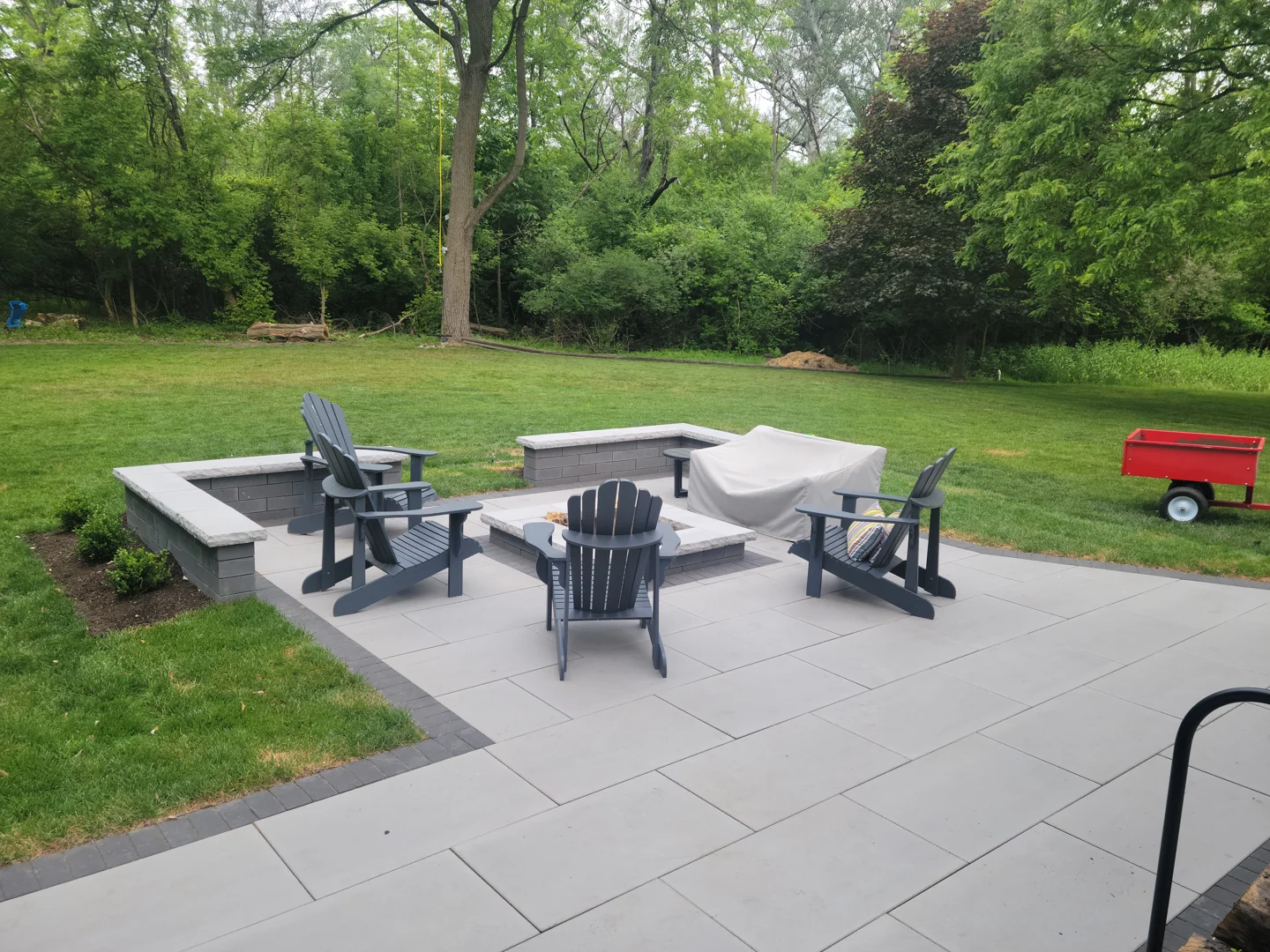 Modern geometric fire feature on a luxury patio - custom fire pits