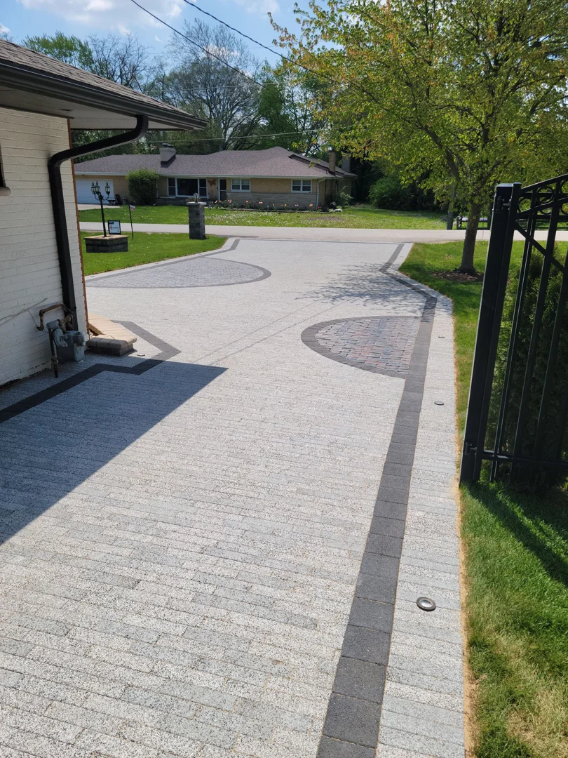 custom-designed paver driveway with interlocking patterns - garden paving contractors near me