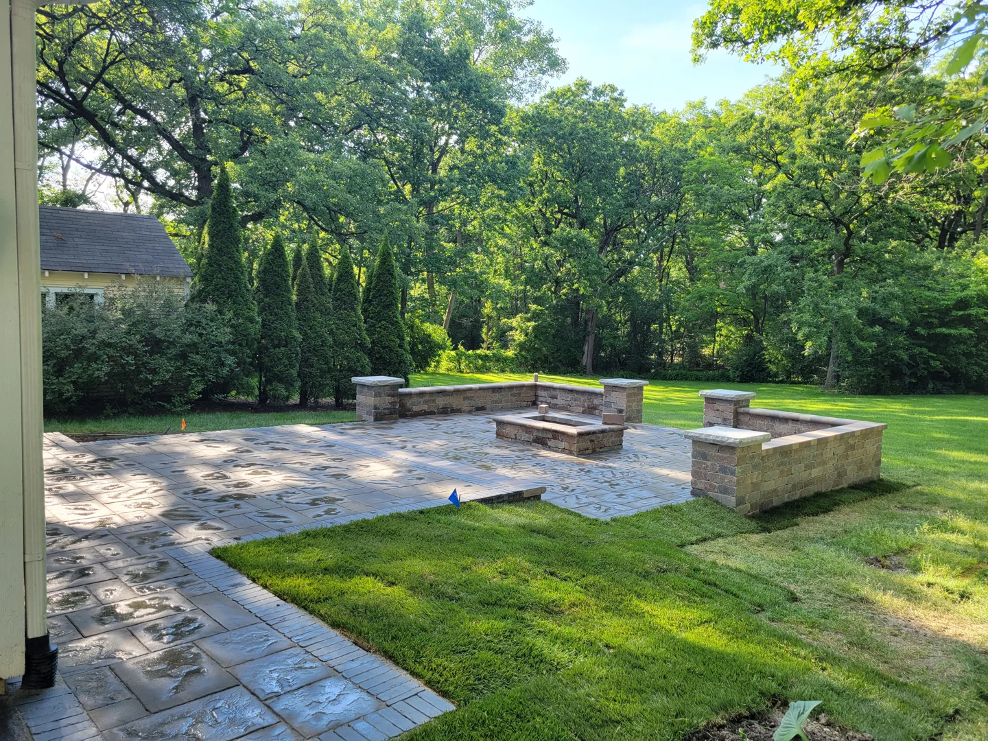 Euro Paving contractor installing a heavy-duty stone base for a custom fire pit - fire pit contractors