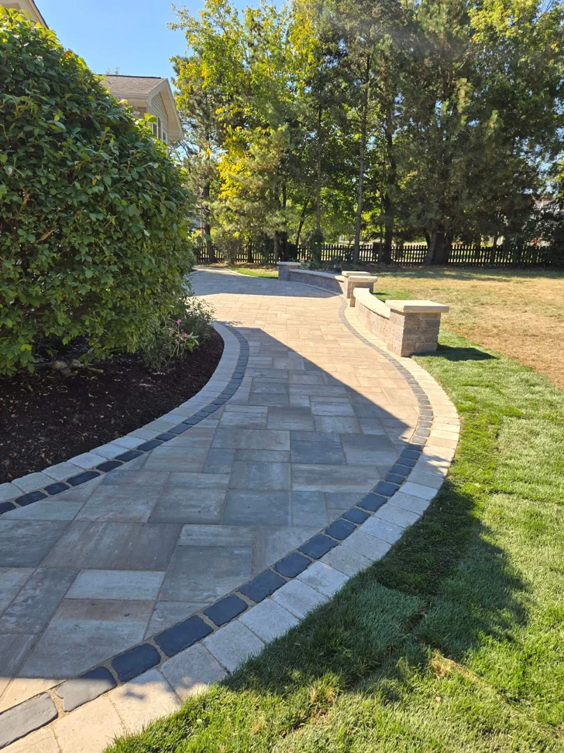 Euro Paving professional crew using precision tools to mark a perfect circular patio layout Euro Paving professional crew using precision tools to mark a perfect circular patio layout