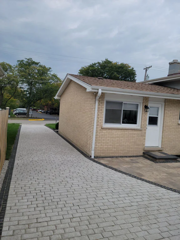 pavers over concrete walkway