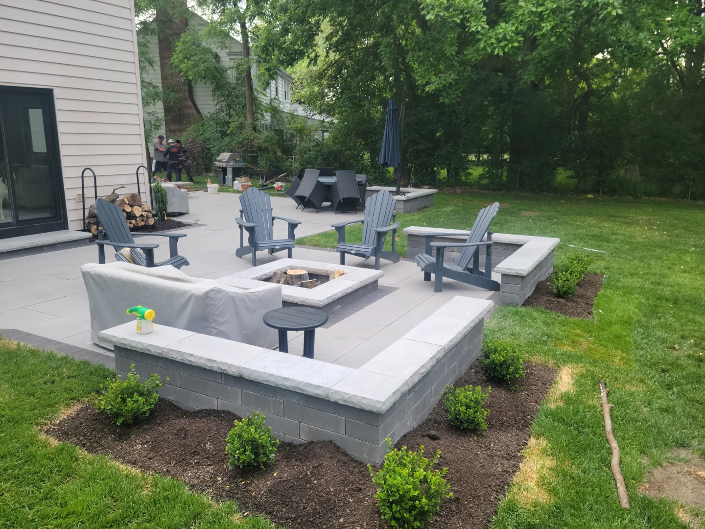 various creative DIY brick fire pit designs on suburban patios and lawns