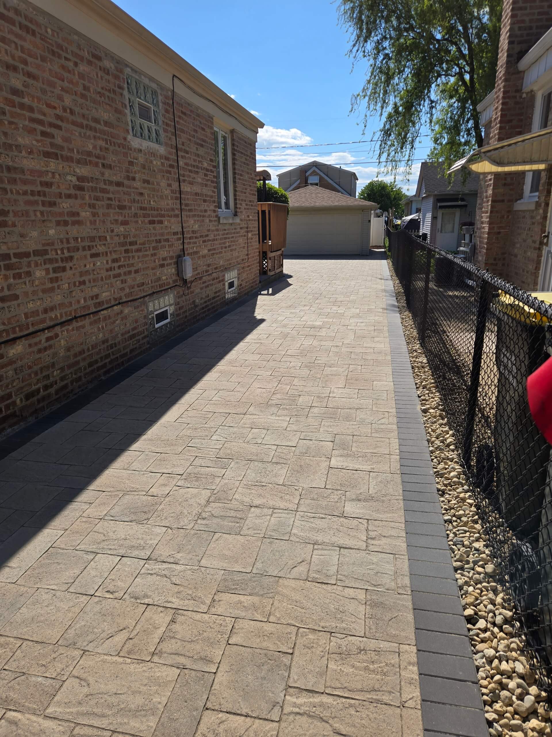 A newly installed brick driveway leading to a garage in Chicago.