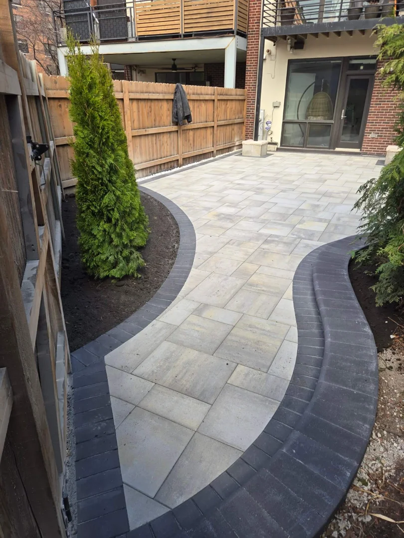 hybrid brick paver patio featuring river rock drainage borders and perimeter landscape planters hybrid brick paver patio featuring river rock drainage borders and perimeter landscape planters