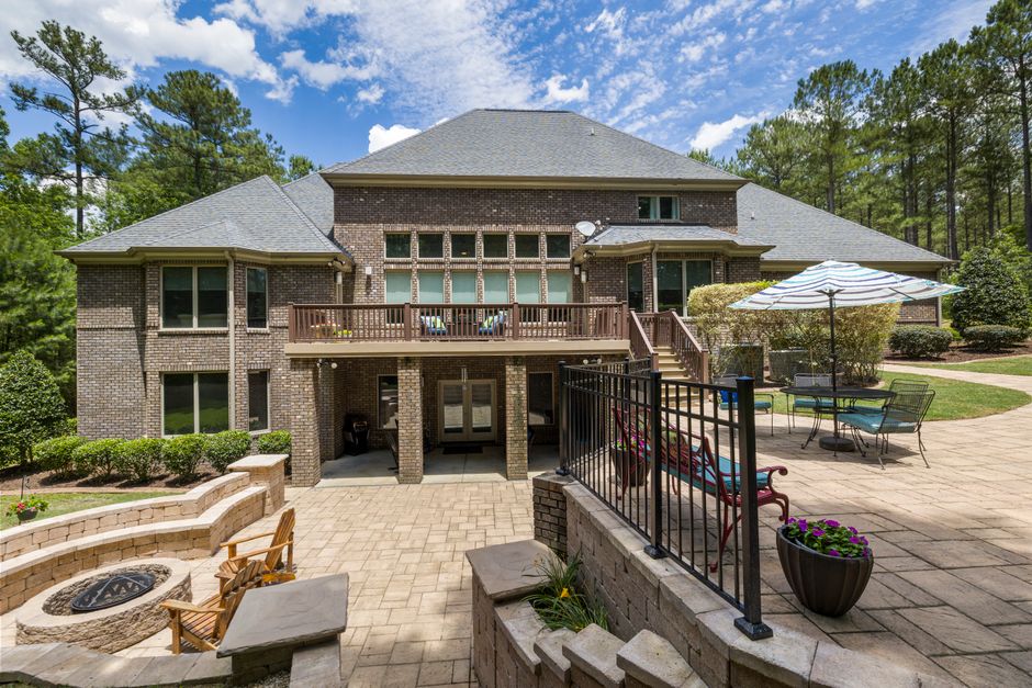 multi-level red paver patio design with custom seating multi-level red paver patio design with custom seating