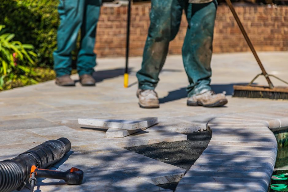 professional crew laying pavers