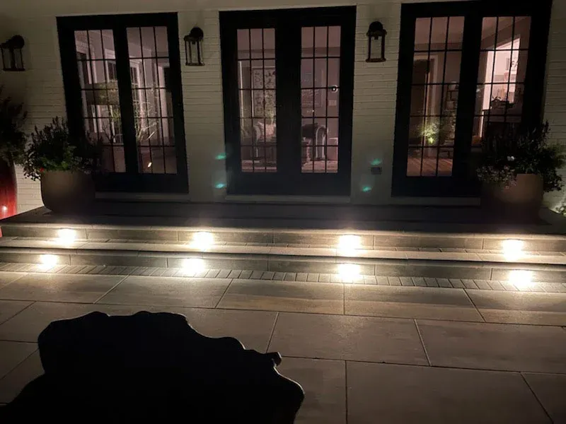illuminated brick risers on a raised suburban patio illuminated brick risers on a raised suburban patio